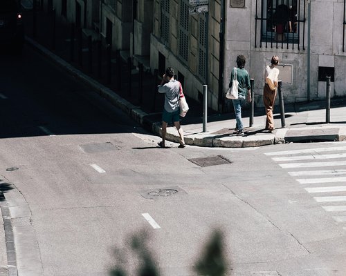 A view of urban streets in Peru with pedestrians walking peacefully
