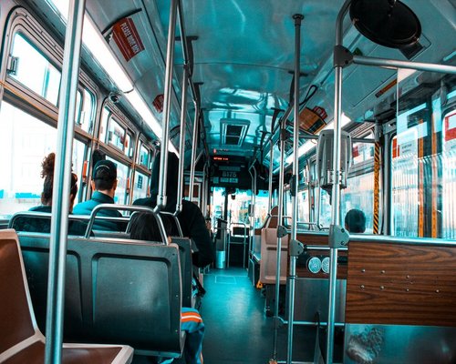 Commuters riding a modern bus in the city